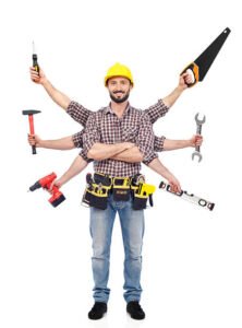 Handyman in Huntington Beach, CA, holding various tools, showcasing readiness for a task or project.